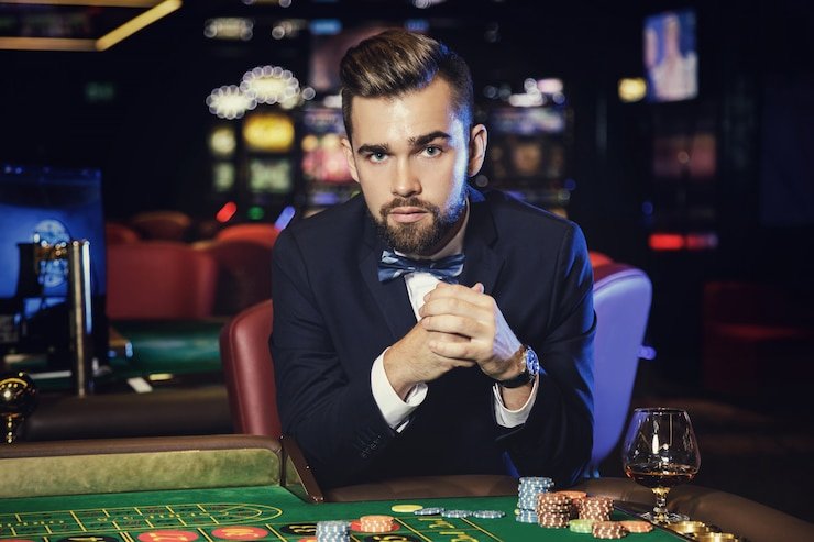 Live dealer revealing community cards on Texas Hold'em Bonus board
